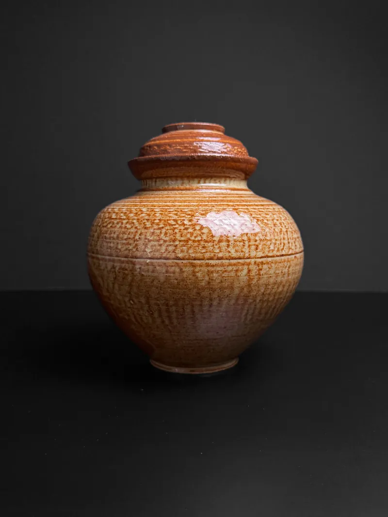 Carved amber lidded jar