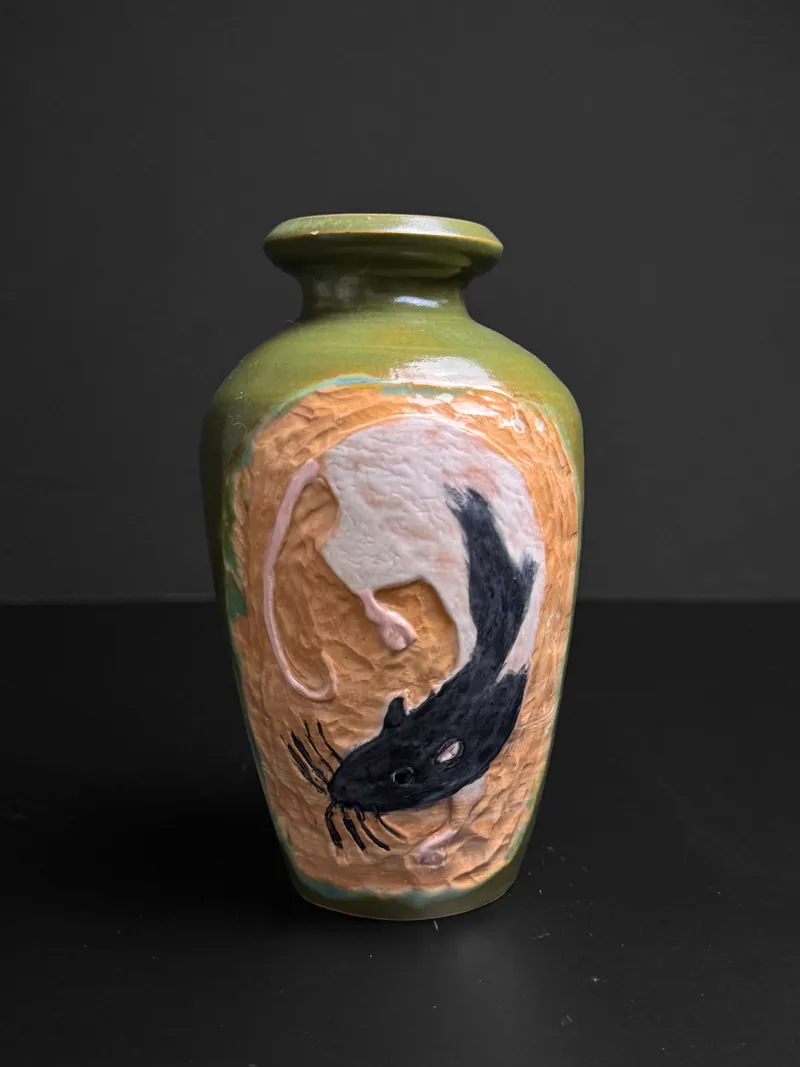 Vase with a carved koi on a green ground