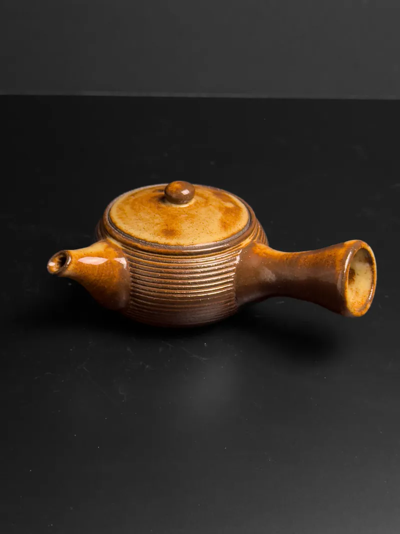 Side-handle teapot in amber glaze