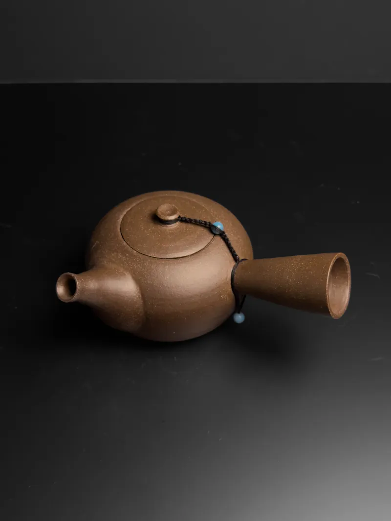 Unglazed brown side-handle teapot